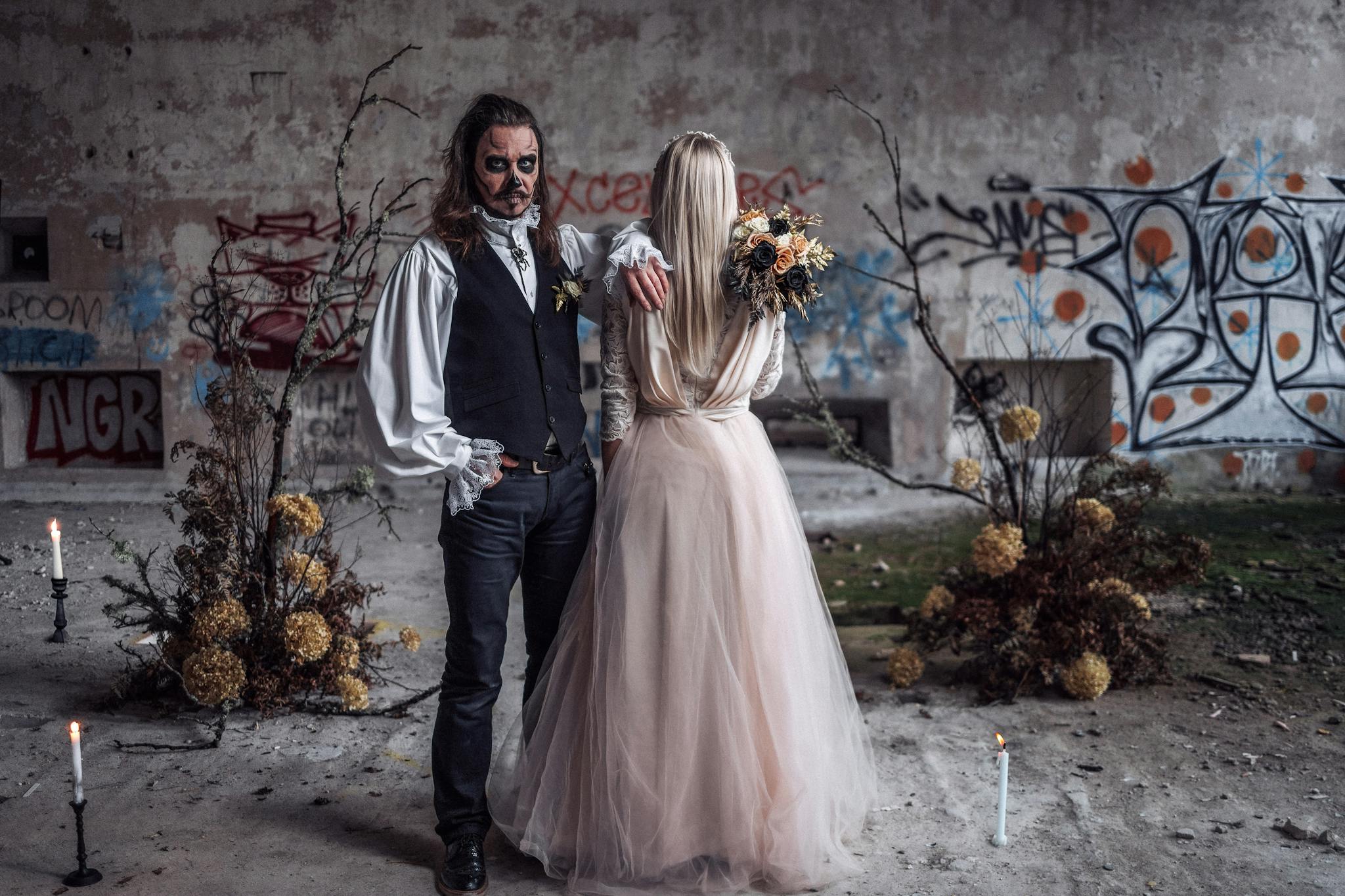 About A Couple In Halloween Costumes Poses In